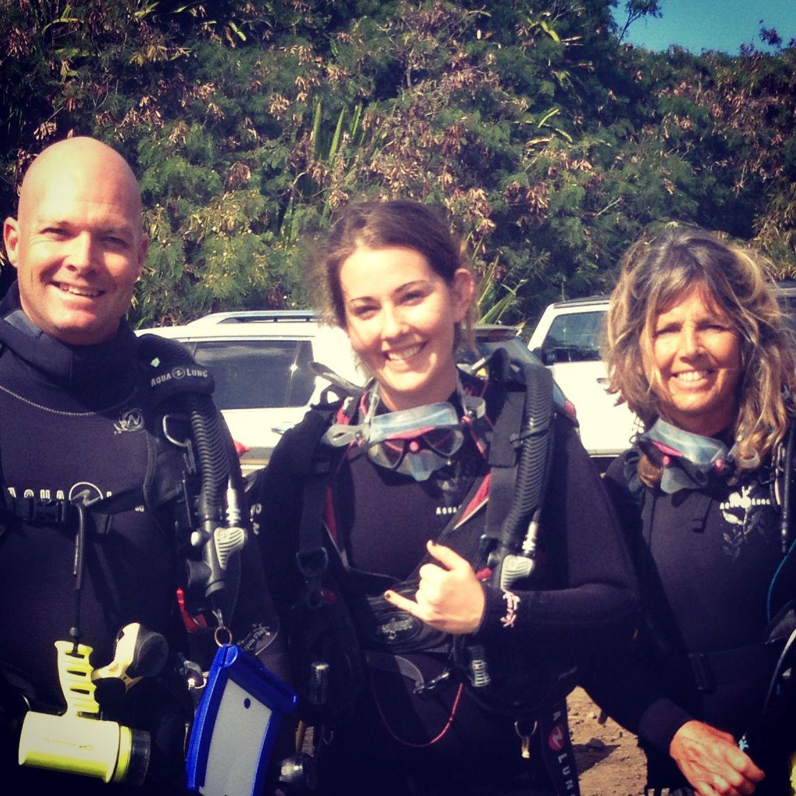 The Fathom Five Family – Ready to Dive A group of divers fully equipped with scuba gear in Kauai, Hawaii.