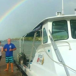 a group of people standing in front of a car