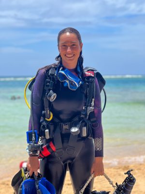 a person standing next to a body of water